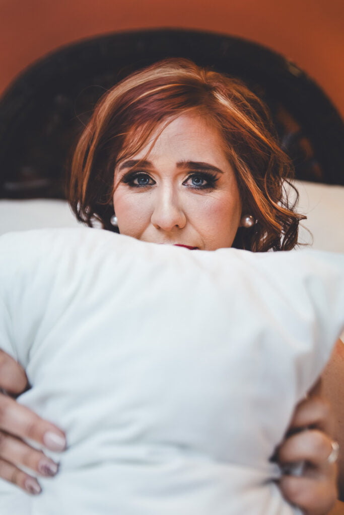 A close-up of a photographer capturing a moment, emphasizing that boudoir photography goes beyond the visual—it's about emotions and empowerment